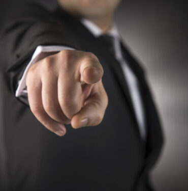 Businessman points his finger at you